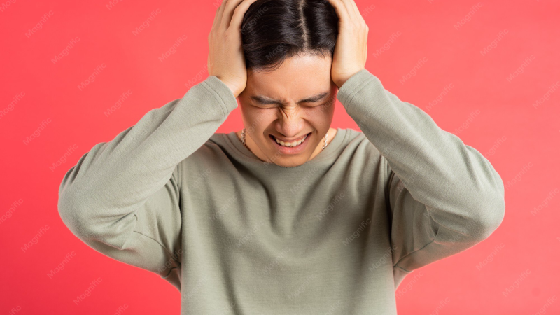 person experiencing mid-day fatigue at desk