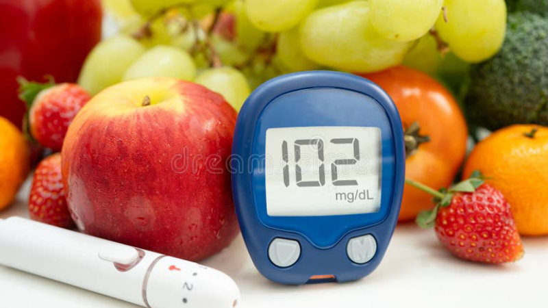blood glucose monitoring with healthy food background