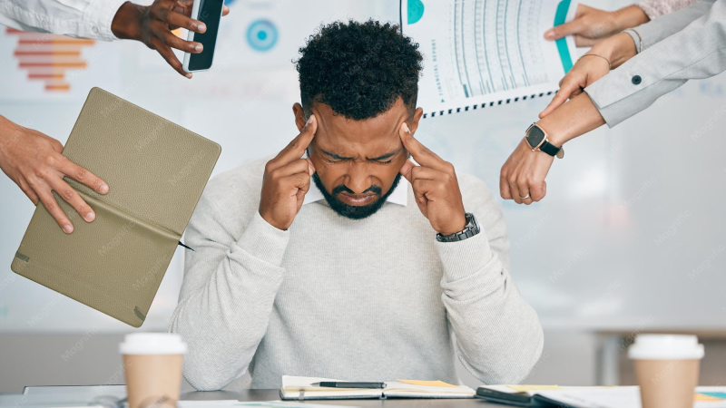 person experiencing stress at desk