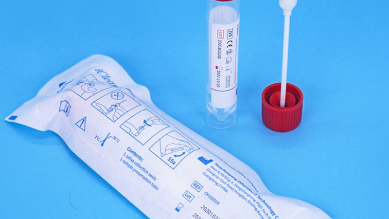 close-up of saliva sample collection with a sterile tube and swab