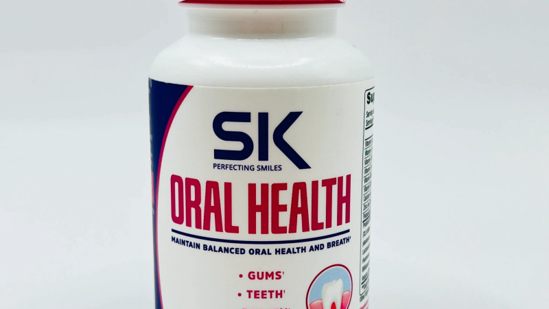 bottle of oral health supplement with enamel-strengthening ingredients